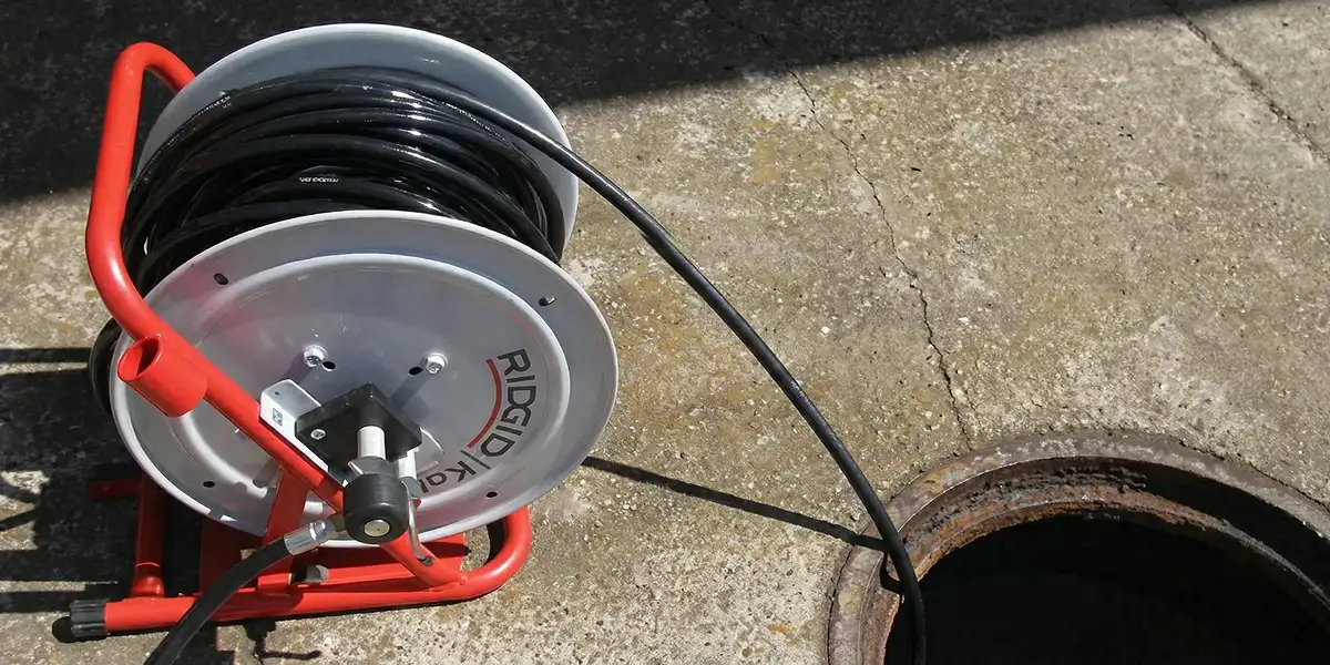 sewer rodding equipment prepared to clear clogged sewer lines in Pittsburgh, PA