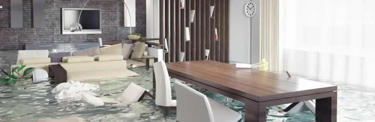 home interior affected by water damage with flooded floors and displaced furniture in Pittsburgh, PA