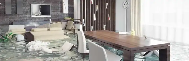 home interior affected by water damage with flooded floors and displaced furniture in Pittsburgh, PA